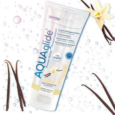 Tubo branco de lubrificante AQUAglide com sabor baunilha e vagens de baunilha ao redor