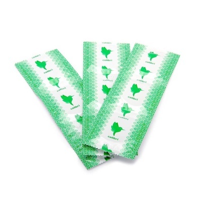 Embalagens brancas com padrões e beija-flor verde com texto colibrí