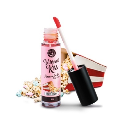Gloss labial vibrante Sweet Popcorn com aplicador, junto a pipocas coloridas e caixa