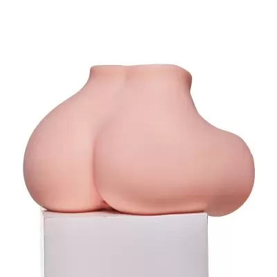 Modelo de silicone cor de pele em forma de nádegas humanas sobre caixa branca