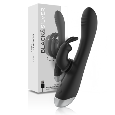 Vibrador preto em silicone com dupla estimulação e base prateada junto a caixa do produto