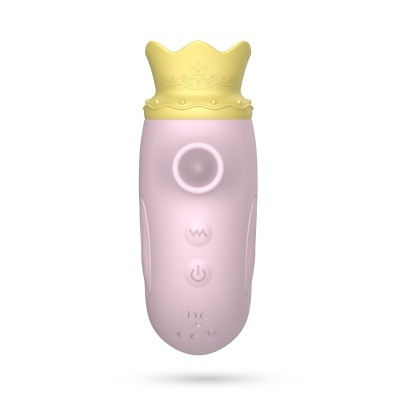 Aparelho elétrico rosa claro com tampa em forma de coroa amarelo claro