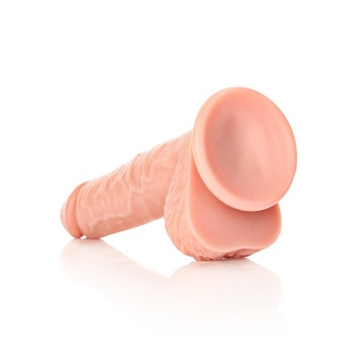 Produto em silicone cor de pele com formato realista e ventosa base larga.