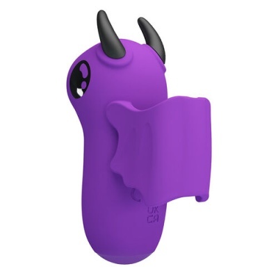 Brinquedo ou acessório roxo com asas e chifres pretos e olhos grandes