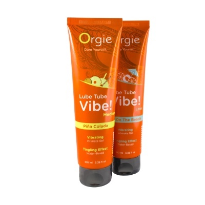 Dois tubos laranja de gel íntimo vibratório com texto e imagens de frutas