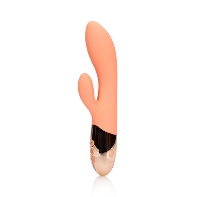 Vibrador cor de salmão em silicone com dois braços e base dourada com botões
