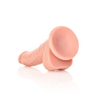 Produto em forma de falo cor pele com base larga