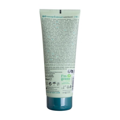 tubo verde claro de massagem e lubrificante à base de água com tampa azul e texto multilíngue