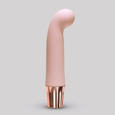 Produto cor-de-rosa com base metálica dourada e forma curva