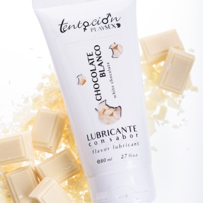 Frasco branco de lubrificante sabor chocolate branco com pedaços de chocolate branco ao redor
