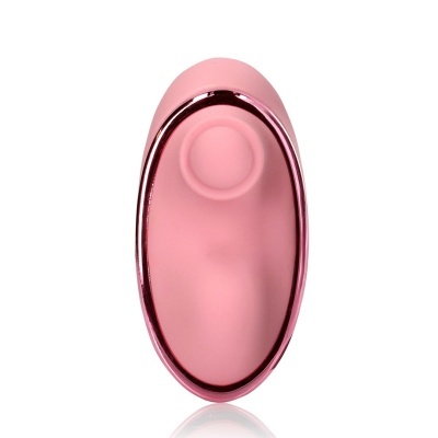 Produto cor de rosa oval com contorno metálico e cavidade circular no centro