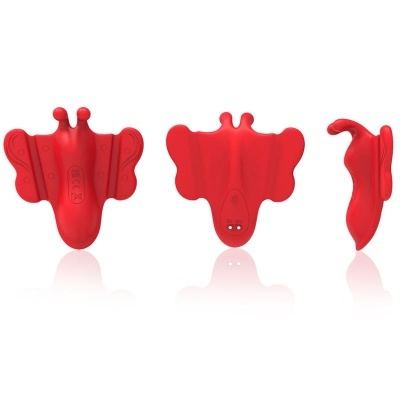 Objeto vermelho em forma de borboleta visto de três ângulos diferentes.