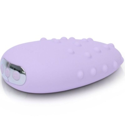 Dispositivo oval lilás em silicone com texturas e botões rosados