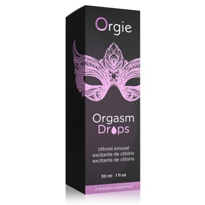 Embalagem do produto Orgasm Drops de cor preta com máscara roxa desenhada e texto em branco e roxo.
