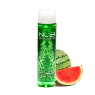 Frasco verde translúcido de óleo quente NUEL com melancia inteira e fatia de melancia