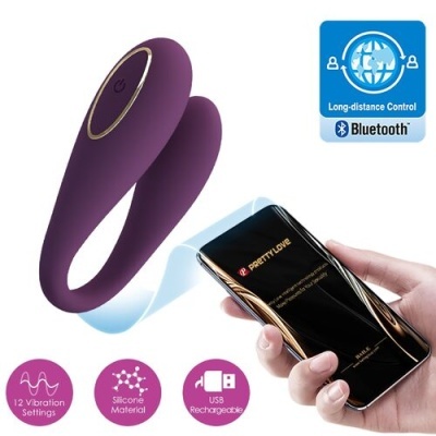 Dispositivo roxo em silicone com controle via telemóvel em fundo branco