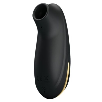Dispositivo preto curvo com abertura circular e detalhes dourados