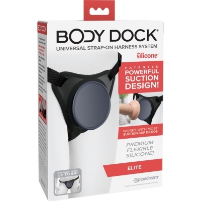 Embalagem do sistema UNIVERSAL STRAP-ON HARNESS BODY DOCK com alças pretas e disco cinzento