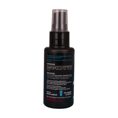 Frasco preto de spray com tampa transparente e rótulo textual em várias línguas.