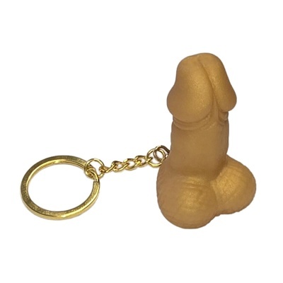 porta-chaves dourado com pendente em forma de pénis