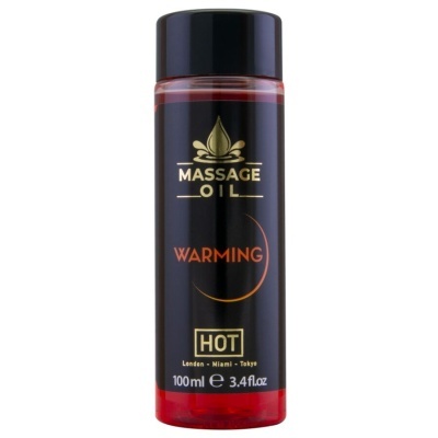 Frasco preto de óleo para massagem com tampa preta e líquido vermelho visível na base