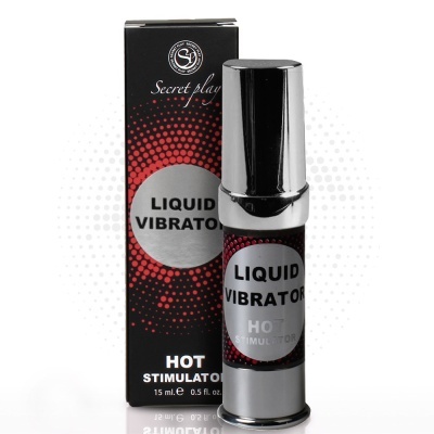 Frasco metálico prateado e preto com rótulo LIQUID VIBRATOR e caixa preta ao fundo