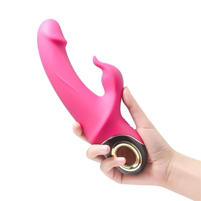 Vibrador rosa de silicone com botão dourado na base