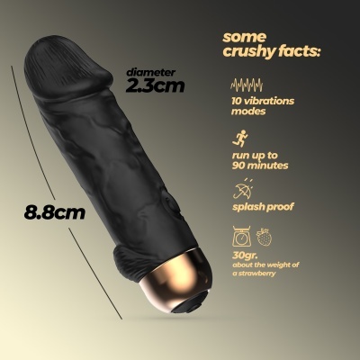 Vibrador preto texturizado com base dourada e descrições de funcionalidades ao lado em texto amarelo e preto.