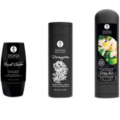 Três produtos Shunga Erotic Art em frascos pretos com rótulos brancos e imagem colorida no tubo maior.