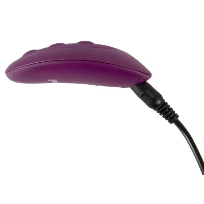 Produto elétrico portátil roxo com cabo preto conectado