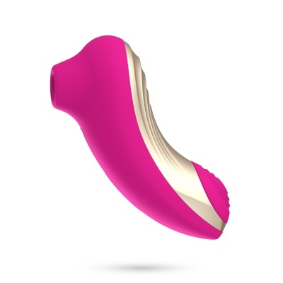 Dispositivo cor-de-rosa e bege com forma ergonómica sobre fundo branco