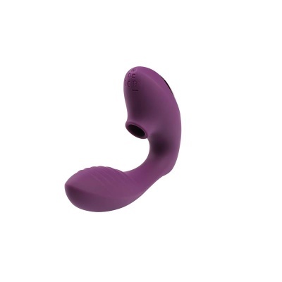 Aparelho roxo com abertura circular e superfície curva sobre fundo branco