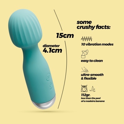 Vibrador azul turquesa com base prateada e informações técnicas em fundo amarelo