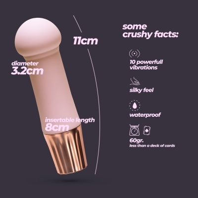 Vibrador rosa claro com base rosa dourada e texto informativo sobre dimensões e características.
