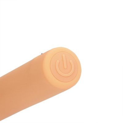 Objeto cilíndrico cor de pele com botão de ligar/desligar