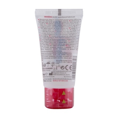 Frasco de lubricante à base de água com tampa vermelha e texto em várias línguas.