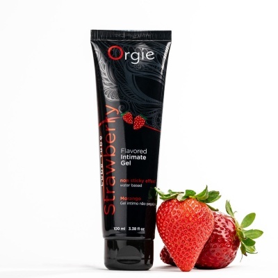 Gel íntimo Orgie sabor morango em tubo preto com morangos ao lado