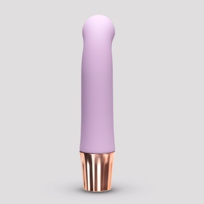 Objeto cilíndrico rosa com base metálica dourada