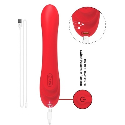 Vibrador vermelho com botão de ligar e cabo USB para carregar em fundo branco