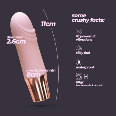 Brinquedo sexual rosa claro com base metálica dourada descrito com características e dimensões.