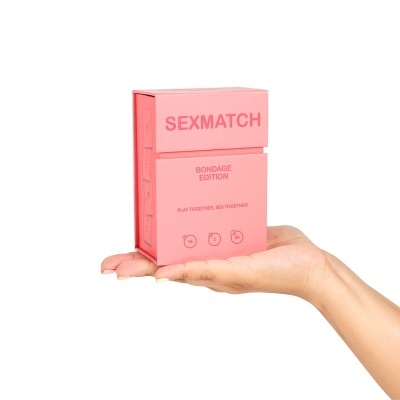 Embalagem rosa de jogo Sexmatch Bondage Edition na mão
