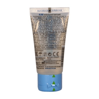Frasco de lubrificante à base de água GLIDE com tampa azul e texto multilíngue
