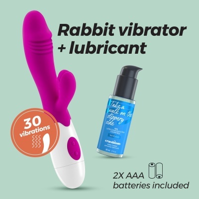 Vibrador tipo rabbit roxo e branco e lubrificante azul sobre fundo verde claro