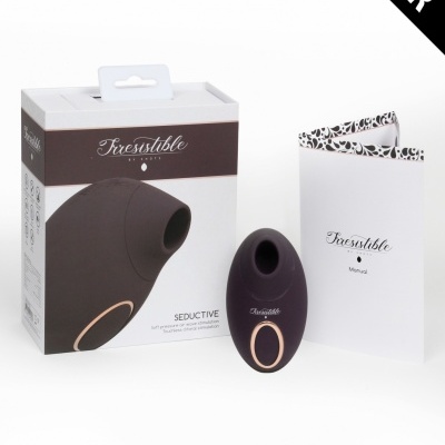 Produto sexual Irresistible em preto com detalhe dourado, embalagem e manual