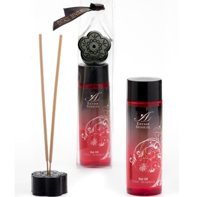 Óleo perfumado Extase Sensuel Hot Oil com suporte e varas de incenso.
