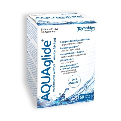 Embalagem branca de lubrificante médico AQUAglide com design azul e texto em alemão e inglês.