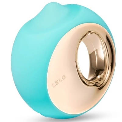 Dispositivo azul turquesa com face dourada e buraco circular e texto LELO