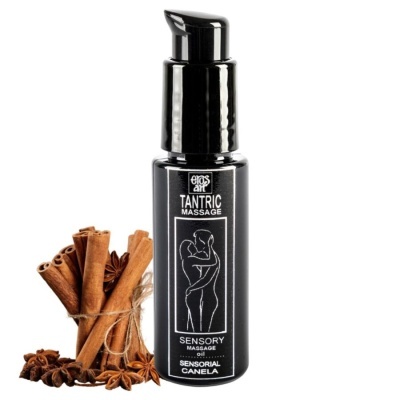 Frasco preto de óleo de massagem sensorial com canela e especiarias ao lado