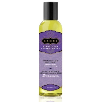 frasco de óleo de massagem com rótulo roxo e tampa preta