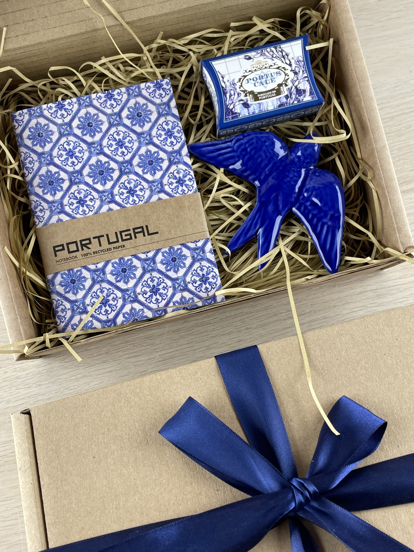 Gift box with Portugal-themed notebook, soap box, and blue ceramic bird